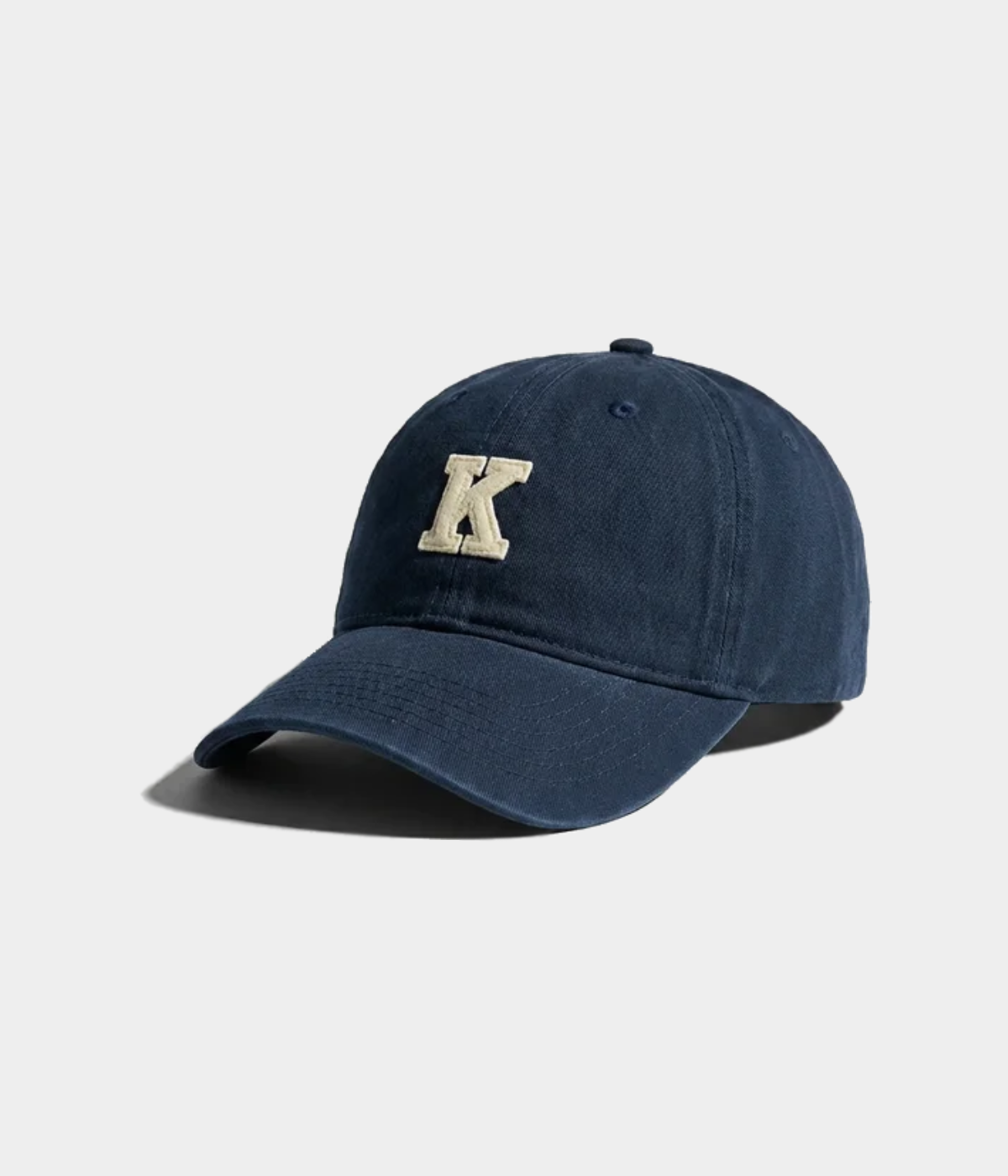 K.